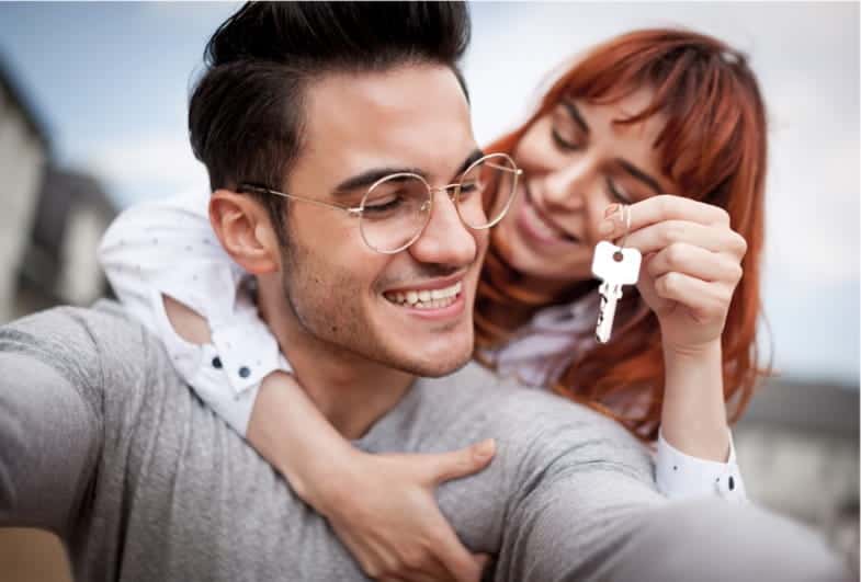 couple holding new set of keys